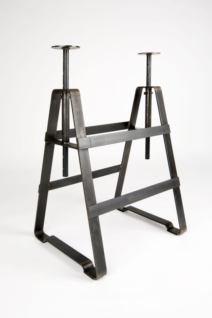 A height adjustable trestle made from oiled crude steel. It is applicable with several shelves and slabs. The same variable as Affe but powder-coated plays Lackaffe with the image of solid steel furniture.